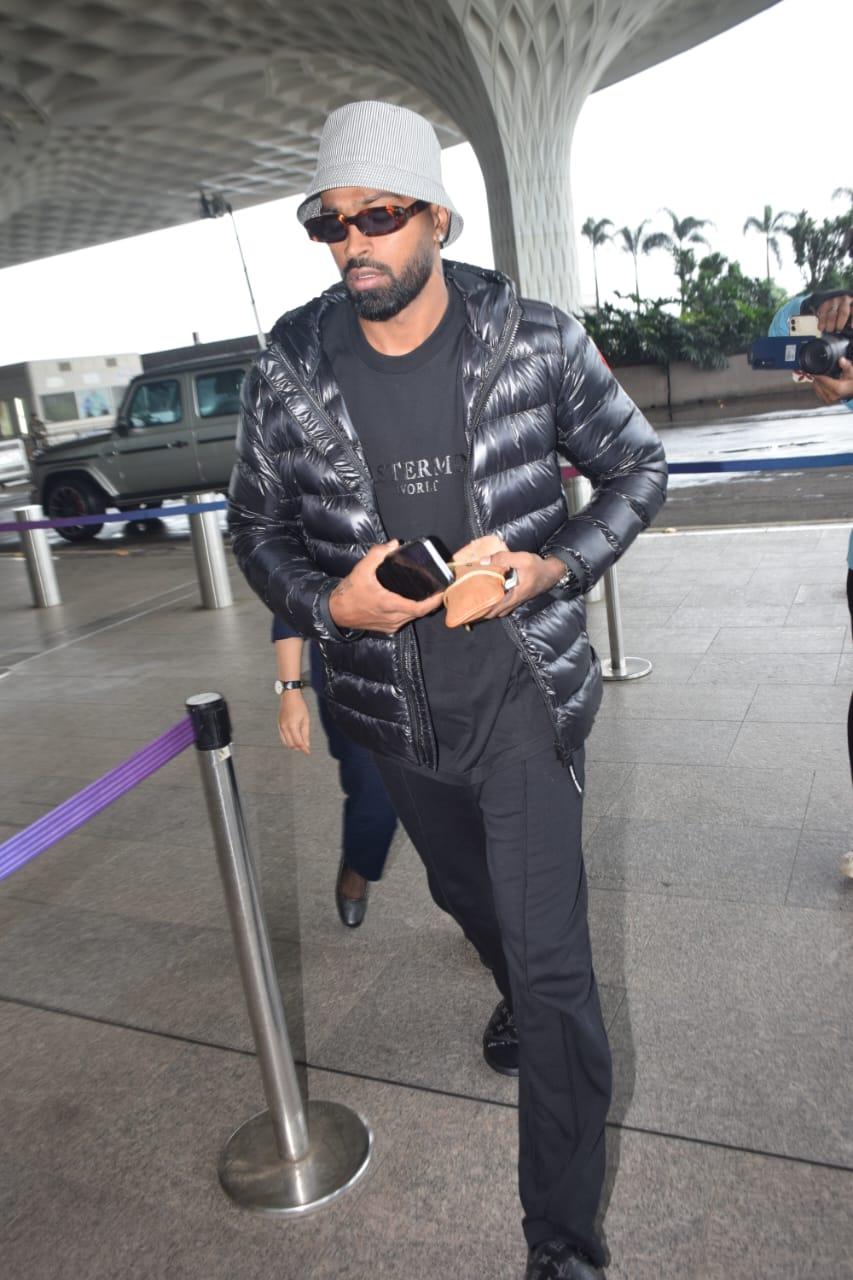 Hardik Pandya, the charismatic cricketer, made a statement at the airport with his suave style. 